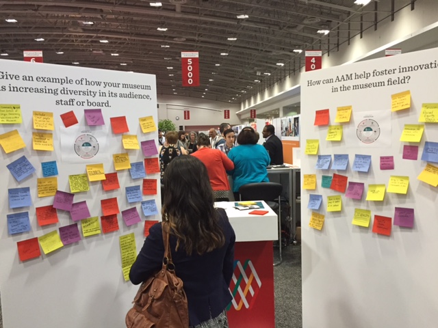 Sticky notes on a poster board used to gather feedback