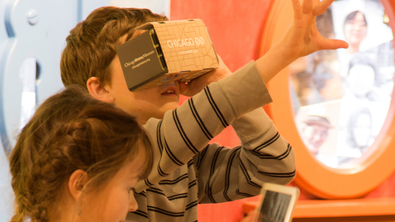 Children using a VR headset and AR app on an iPad inside a museum