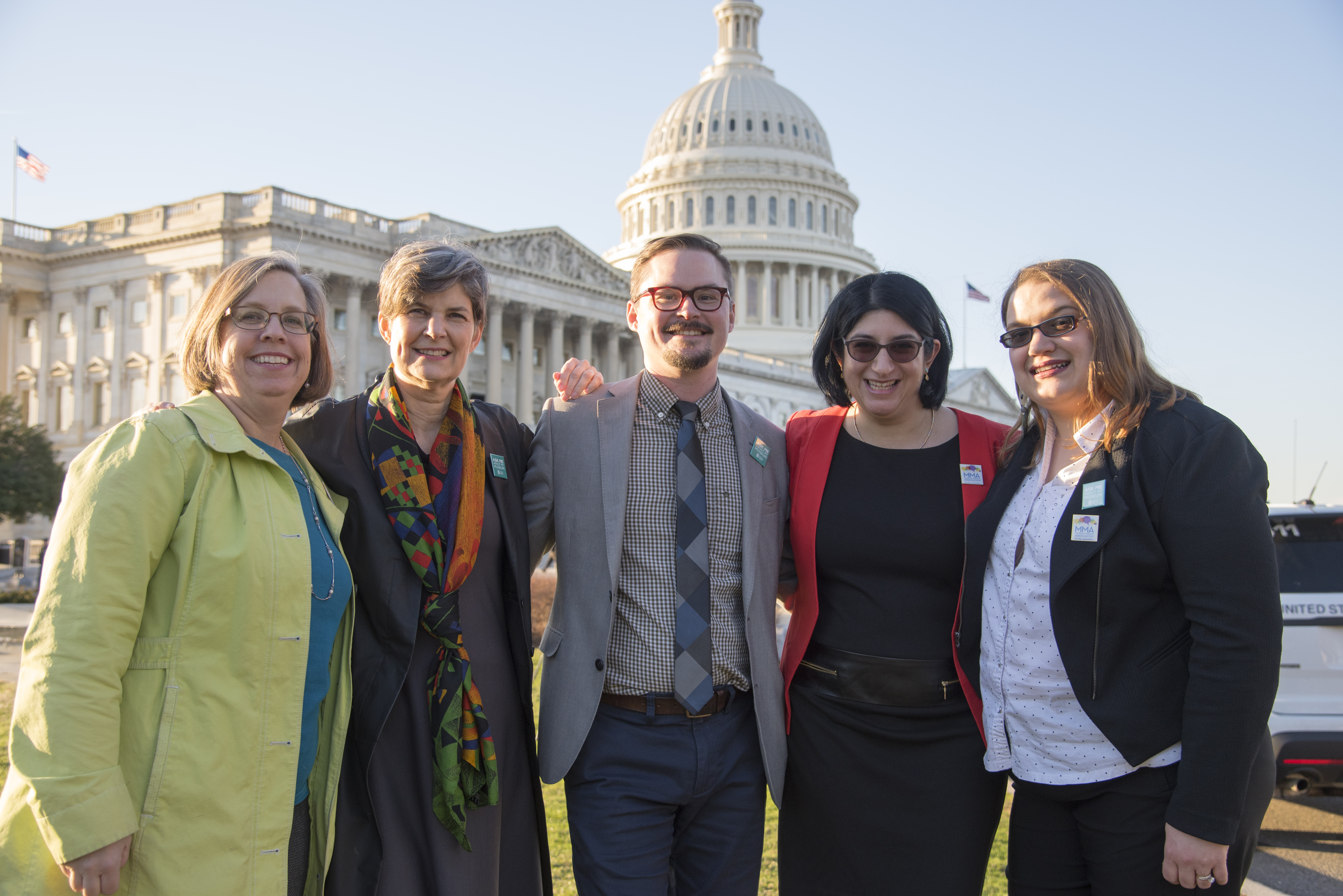 group of people in front of the Capitol building