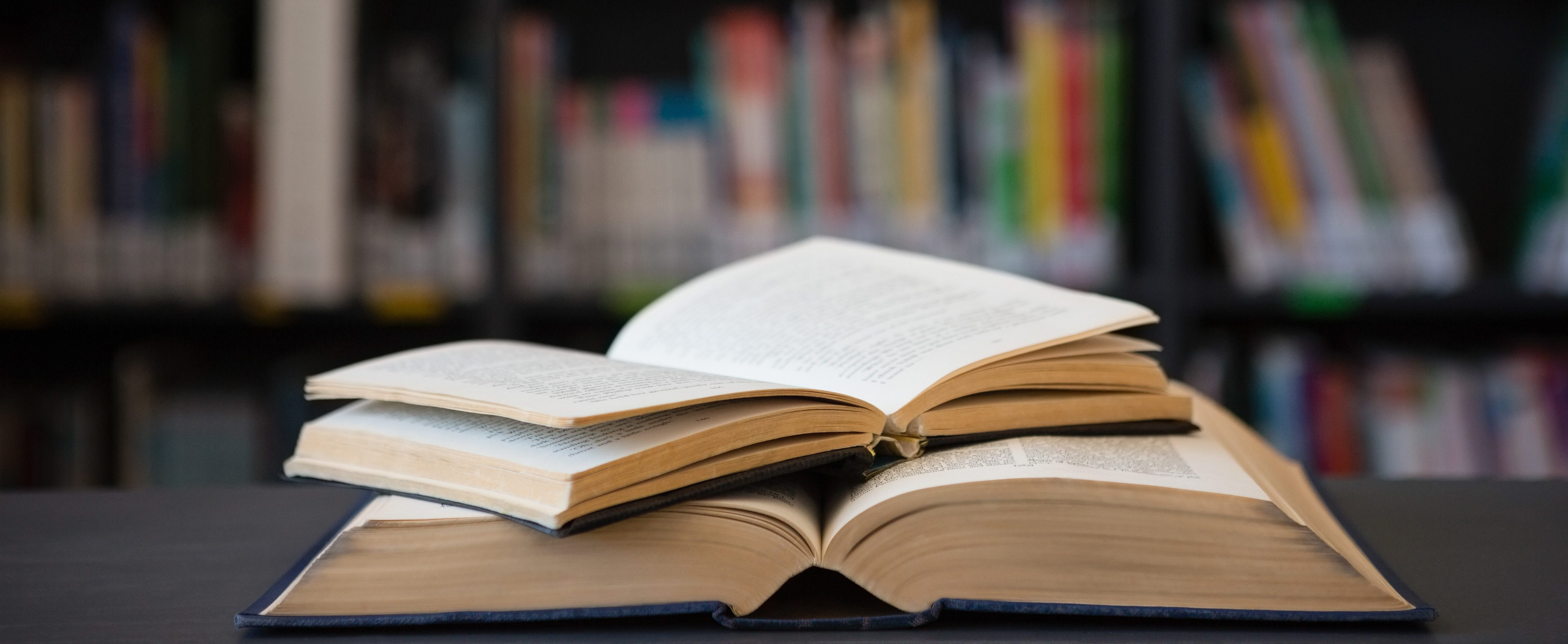 Close up of open books on table.