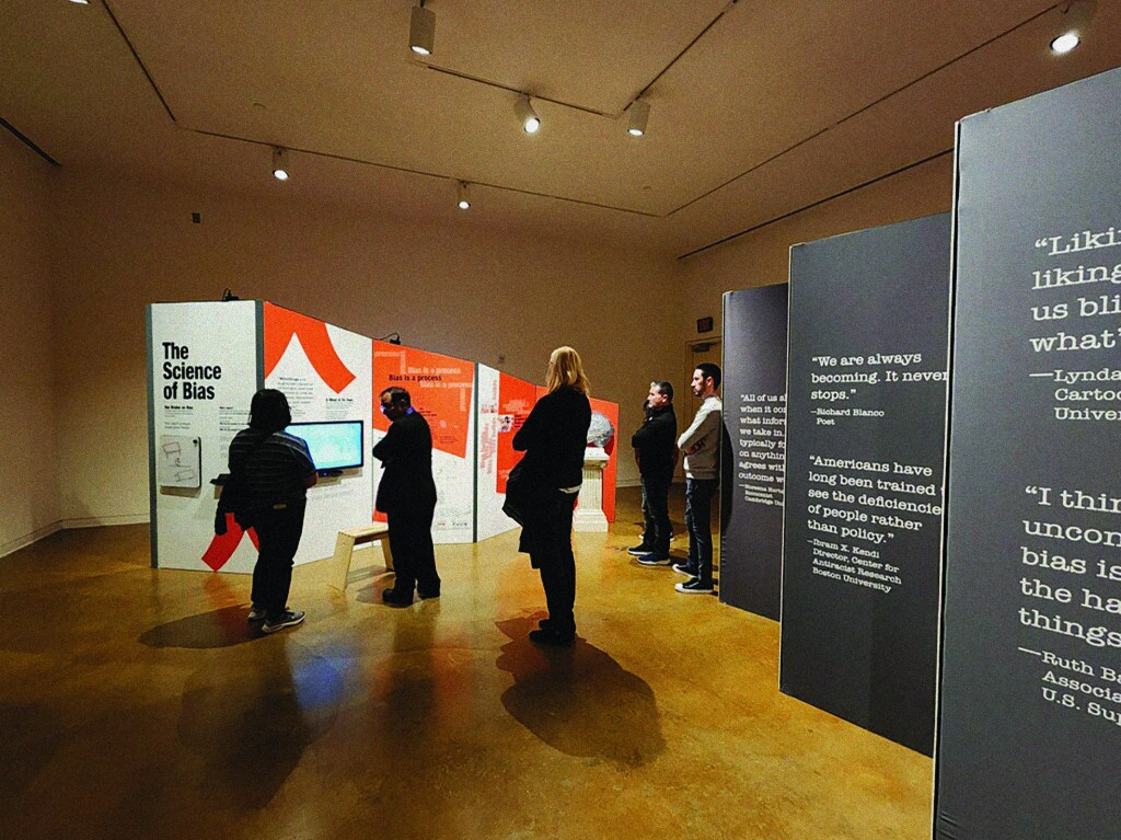 People walking through a museum exhibition