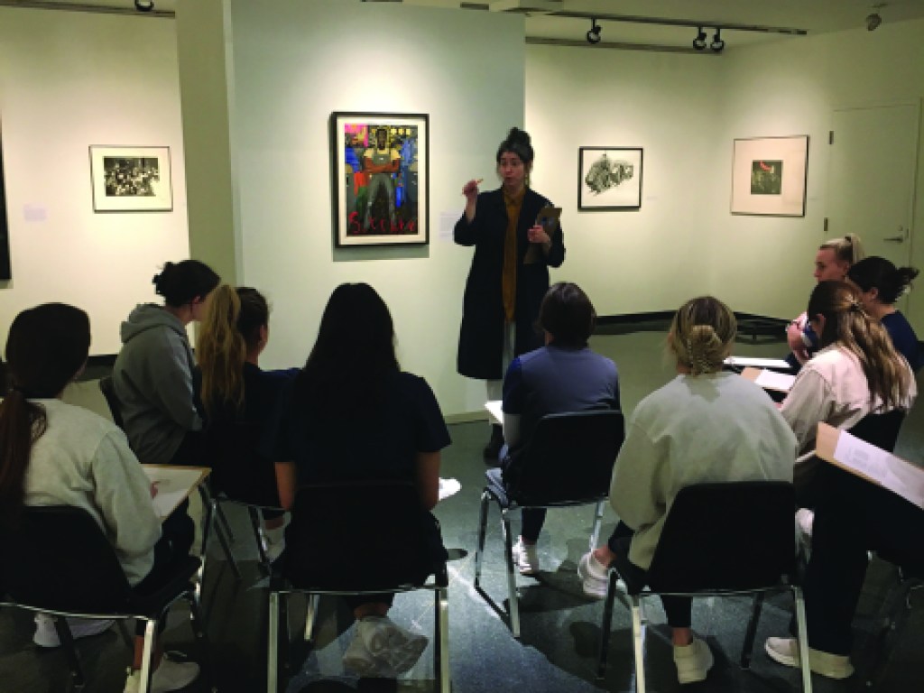 Molly Bolick, Education and Communications Manager, leading a class of nursing students in a discussion of Sue Coe’s painting Strike, 1980. Photo credit: Kathy McKenna