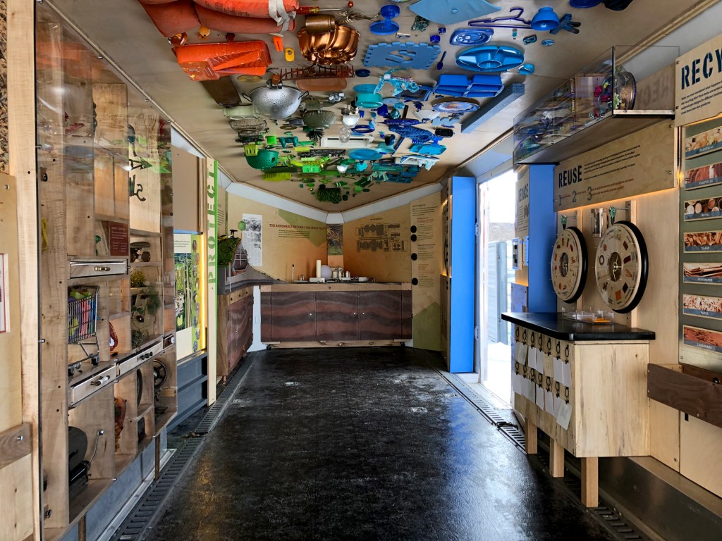 A gallery constructed out of salvaged wood and household objects