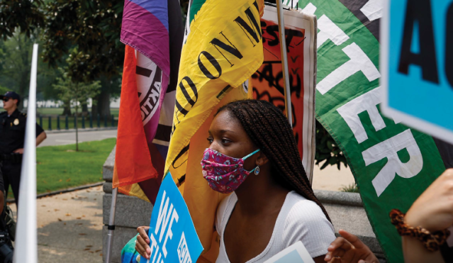 Protesters demonstrate on Capitol Hill during 2023 Supreme Court deliberations regarding race-conscious admissions at Harvard and the University of North Carolina.