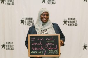 A “Book” (as storytellers in the human library are called), poses at an event in Chicago. Courtesy of Human Library Chicago.