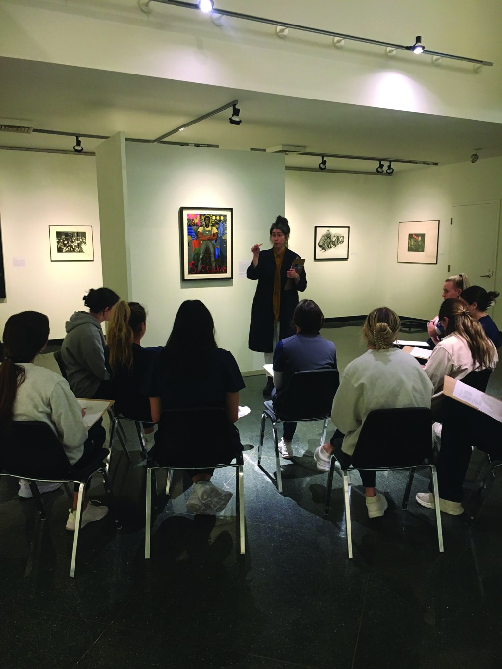 Molly Bolick, Education and Communications Manager, leading a class of nursing students in a discussion of Sue Coe’s painting Strike, 1980. Photo credit: Kathy McKenna