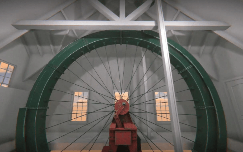 A historic water wheel model housed in Nemours Estate's pumphouse.